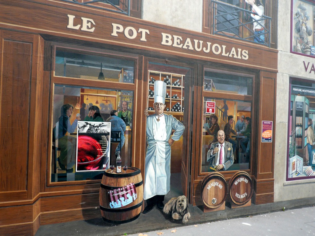 Lyonnais building: detail of a first floor faux painted  restaurant.