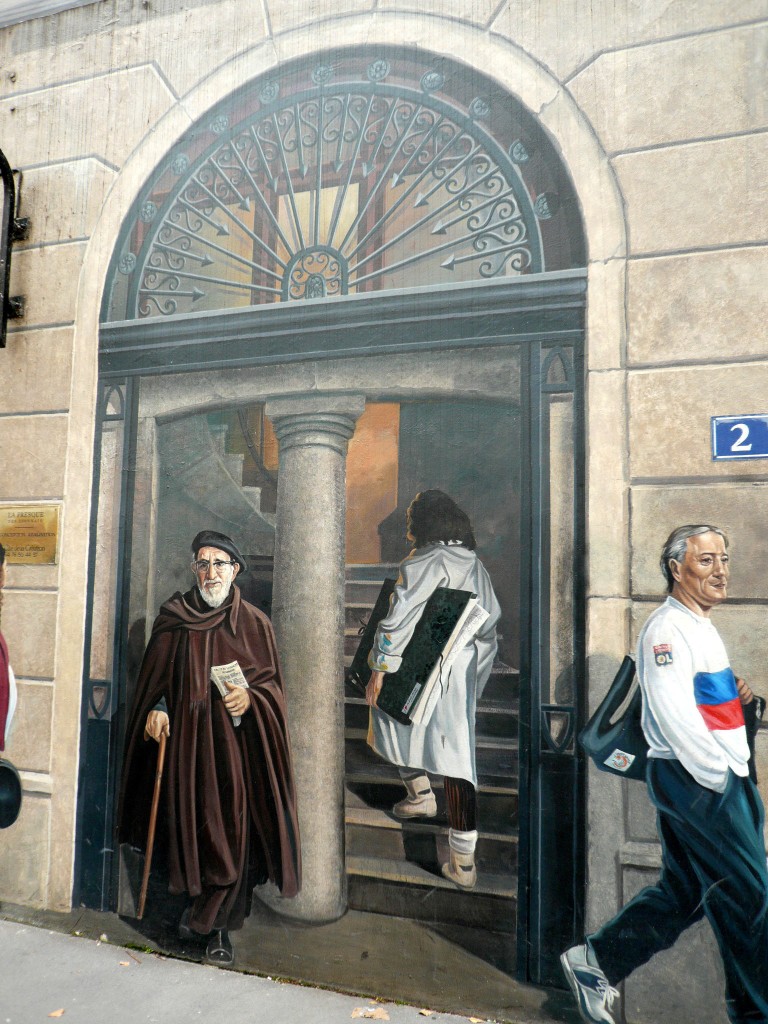 The Lyonnais building, detail of the entrance with the famous "Abbe Pierre"