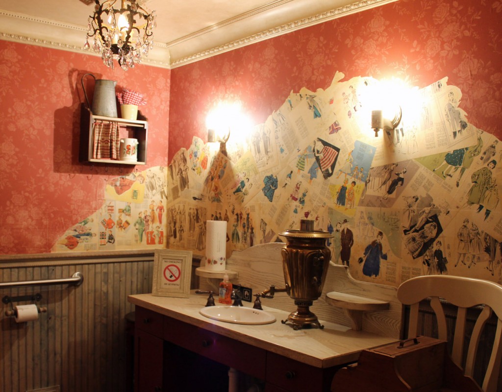 Aged wainscot and distressed crown molding and magazine clippings.