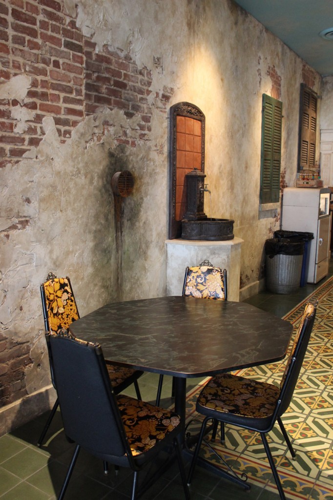 Restaurant distressed walls with traditional cement floor tiles