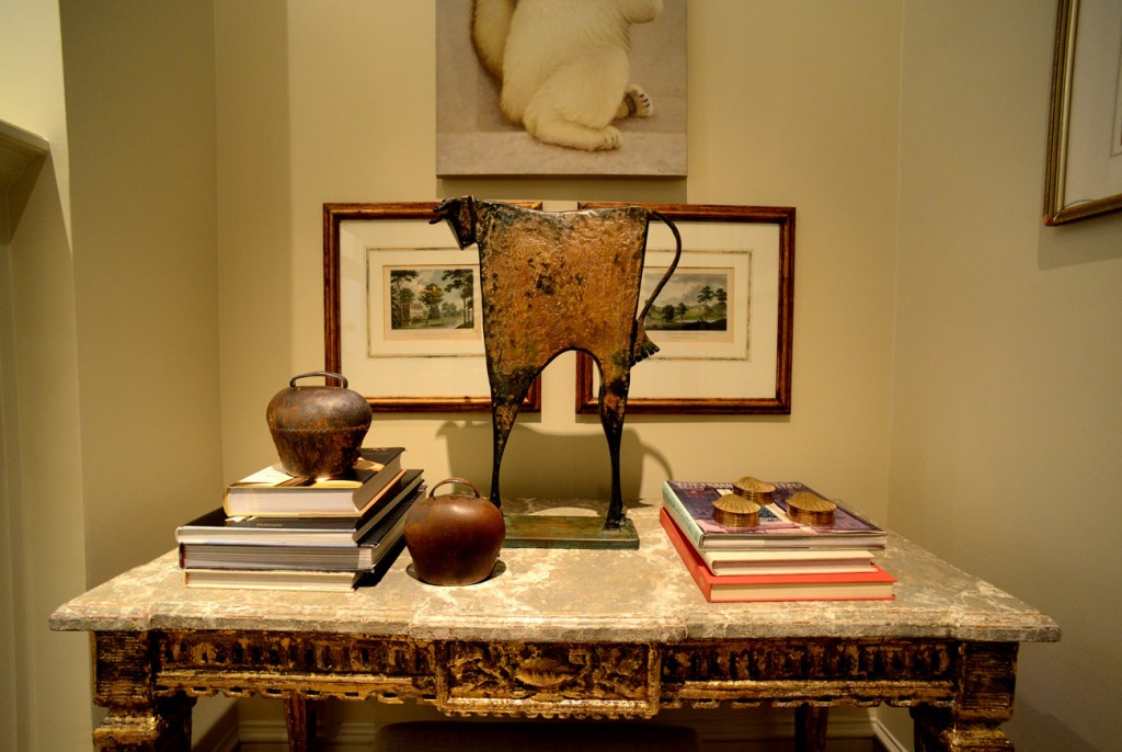 One of the distressed.and gilded consoles