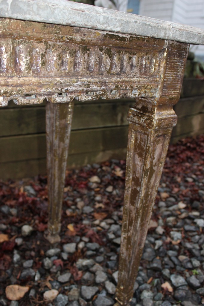 Detail of aged gilding on legs